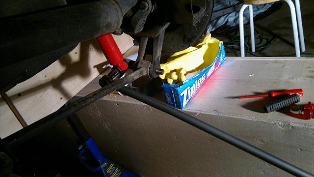 Lower shock mount with lever